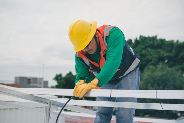 Contractor installing electrical cable